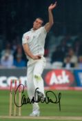 Chris Tremlett signed 12x8 inch colour photo pictured in action for England in test match cricket.