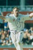 Dominic Cork signed 12x8 inch colour photo pictured while playing Test match cricket for England.