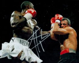 Boxing. Johnny Nelson signed 10x8inch colour photo pictured during one of his world title fights.