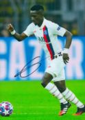 Idrissa Gueye signed 12x8 inch colour photo pictured in action for Paris St Germain in France.