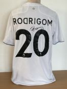 Football. Rodrigo Signed Leeds Utd Replica Home shirt UK size M. Tags still Present. Signed on. Good