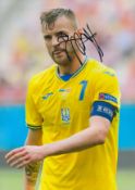 Andriy Yarmolenko signed 12x8 inch colour photo pictured while captaining Ukraine. Good condition.