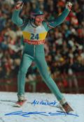 Eddie the Eagle Edwards signed 12x8 inch colour photo pictured in action at the Calgary Winter