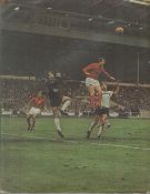 Geoff Hurst signed large colour magazine picture showing Geoff Hurst jumping to head the ball in the