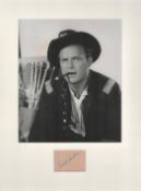 Ralph Meeker signature piece mounted below b/w photo. Approx overall size 14x11. Good condition. All