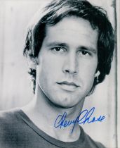 Chevy Chase signed 10x8 inch black and white photo. Good condition. All autographs come with a