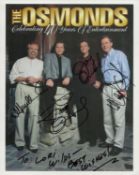 Jimmy Osmond, Merrill Osmond, Jay Osmond and Wayne Osmond signed 10x8 inch 'The Osmonds, Celebrating