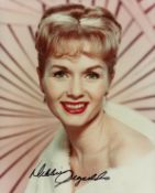 Debbie Reynolds signed 10x8 inch colour photo. Good condition. All autographs come with a