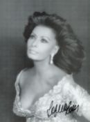 Sophia Loren signed 9.5x7 inch black and white photo. Good condition. All autographs come with a