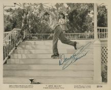 Donald O'Connor signed 10x8 inch 'I Love Melvin' sepia lobby card. Good condition. All autographs
