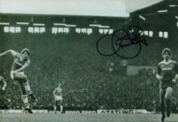 Graeme Sharp signed 12x8 inch black and white photo pictured scoring for Everton in the Merseyside