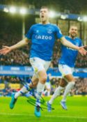 Michael Keane signed 12x8 inch colour photo pictured celebrating while playing for Everton F.C. Good