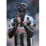 Papiss Cisse signed 12x8 inch colour photo pictured while playing for Newcastle United. Good