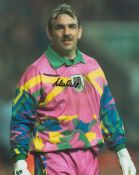 Neville Southall signed 10x8 inch colour photo pictured while playing for Wales. Good condition. All