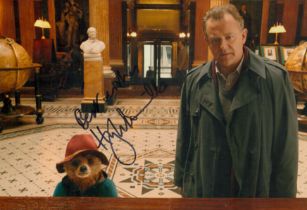 Hugh Bonneville signed 12x8inch colour photo with Paddington. Good condition. All autographs come