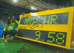 Usain Bolt signed 12x8inch colour photo. Good condition. All autographs come with a Certificate of