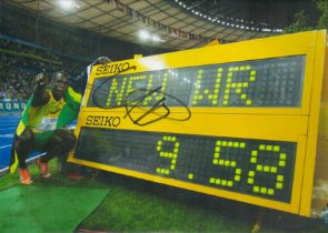 Usain Bolt signed 12x8inch colour photo. Good condition. All autographs come with a Certificate of