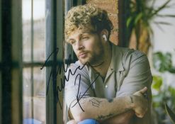 Tom Grennan signed 12x8inch colour photo. Good condition. All autographs come with a Certificate