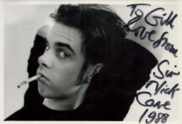 Nick Cave signed10x7inch black and white photo. Dedicated. Good condition. All autographs come