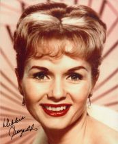 Debbie Reynolds signed 10x8 inch colour photo. Good condition. All autographs come with a