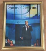 Donny Osmond signed 11x9 inch overall framed colour photo. Good condition. All autographs come