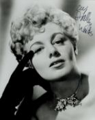 Shelley Winters signed 10x8 inch black and white photo. Good condition. All autographs come with a