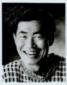 George Takei signed 10x8 inch black and white photo. Dedicated. Good condition. All autographs