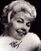 Doris Day signed 10x8 inch black and white photo. Good condition. All autographs come with a