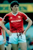 Frank Stapleton signed 12x8 inch colour photo pictured while playing for Manchester United. Good