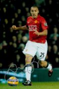 Danny Simpson signed 12x8 inch colour photo pictured in action for Manchester United. Good