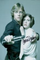 Carrie Fisher signed 12x8 inch Star Wars photo. Good condition. All autographs come with a