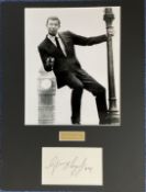 George Lazenby Actor Signed Card With 15x19 Inch Mounted James Bond Photo Display. Good condition.