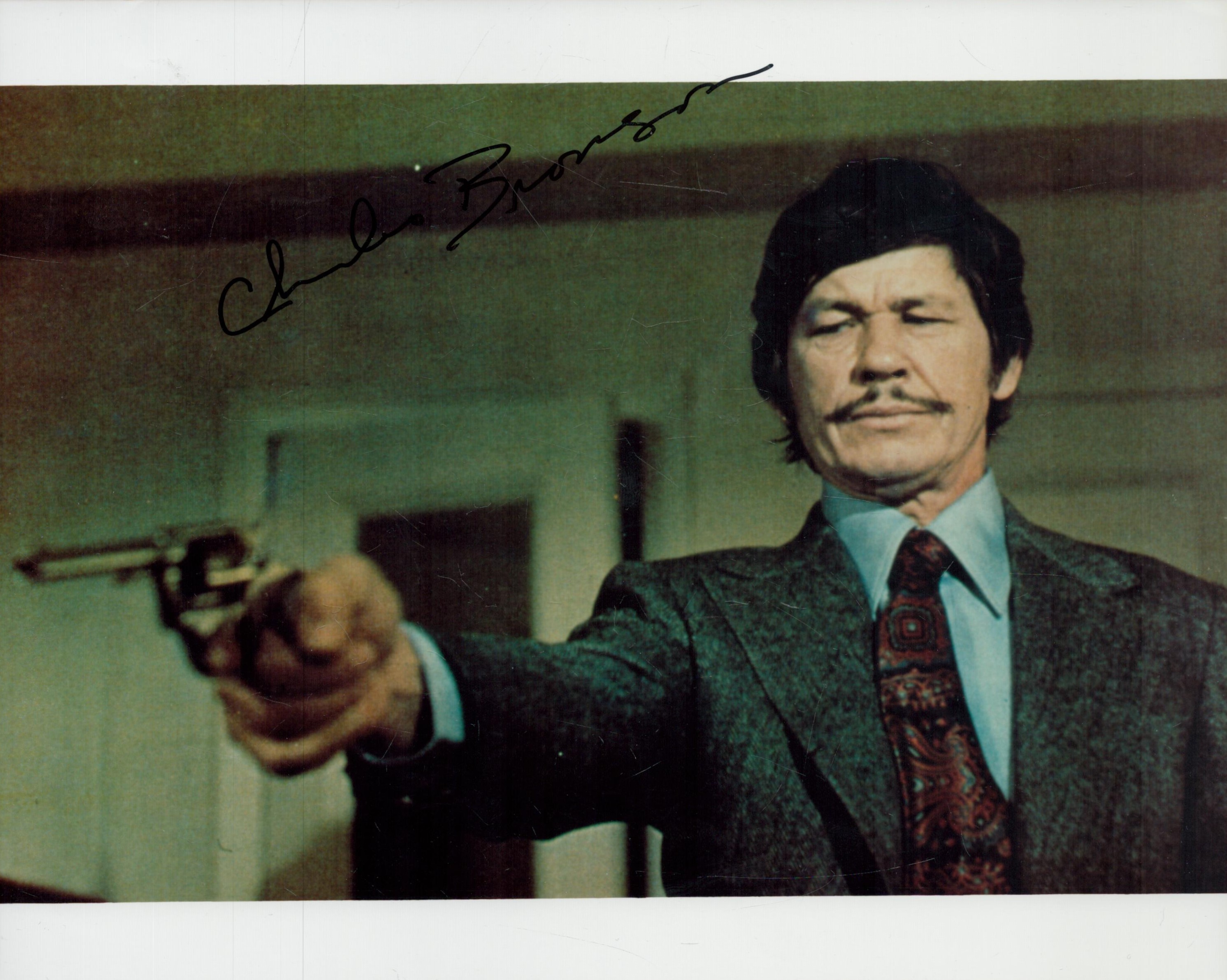 Charles Bronson signed 10x8 inch colour photo. Good condition. All autographs come with a