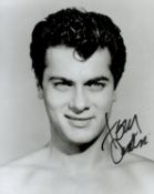 Tony Curtis signed 10x8 inch black and white photo. Good condition. All autographs come with a