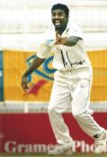 Muttiah Muralitharan signed 12x8 inch colour photo pictured while playing for Sri Lanka. Good