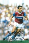 Trevor Brooking signed 12x8 inch colour photo pictured in action for West Ham United. Good