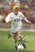 Gordon Strachan signed 12x8 inch colour photo pictured in action for Leeds United. Good condition.