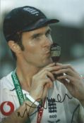 Michael Vaughan signed 12x8 inch colour photo pictured celebrating with the Ashes Urn. Good