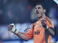 Football Iker Casillas signed 16x12 inch colour photo pictured celebrating while playing for Real