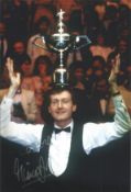 Steve Davis signed 12x8 inch colour photo pictured celebrating with the World Championship trophy.