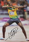 Usain Bolt signed colour photo Approx. 12x8 Inch. OJ CD OLY is a Jamaican retired sprinter, widely