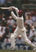 Jimmy Adams signed 12x8 inch colour photo pictured in action for the West Indies. Good condition.