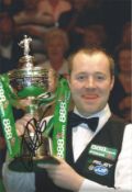 John Higgins signed 12x8 inch colour photo picture celebrating with the World Championship trophy.