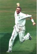 Dominic Cork signed 12x8 inch colour photo pictured while in action for England. Good condition. All