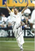 Jason Gillespie signed 12x8 inch colour photo pictured in action for Australia. Good condition.