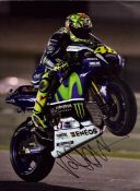 Moto GP Valentino Rossi signed 16x12 inch colour photo. Good Condition. All autographs come with a