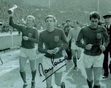 Martin Peters signed 10x8 inch England 1966 World Cup winners black and white photo. Good Condition.