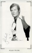 Roger Moore signed 5.5x3.5 inch approx black and white photo mounted on paper. Good condition. All