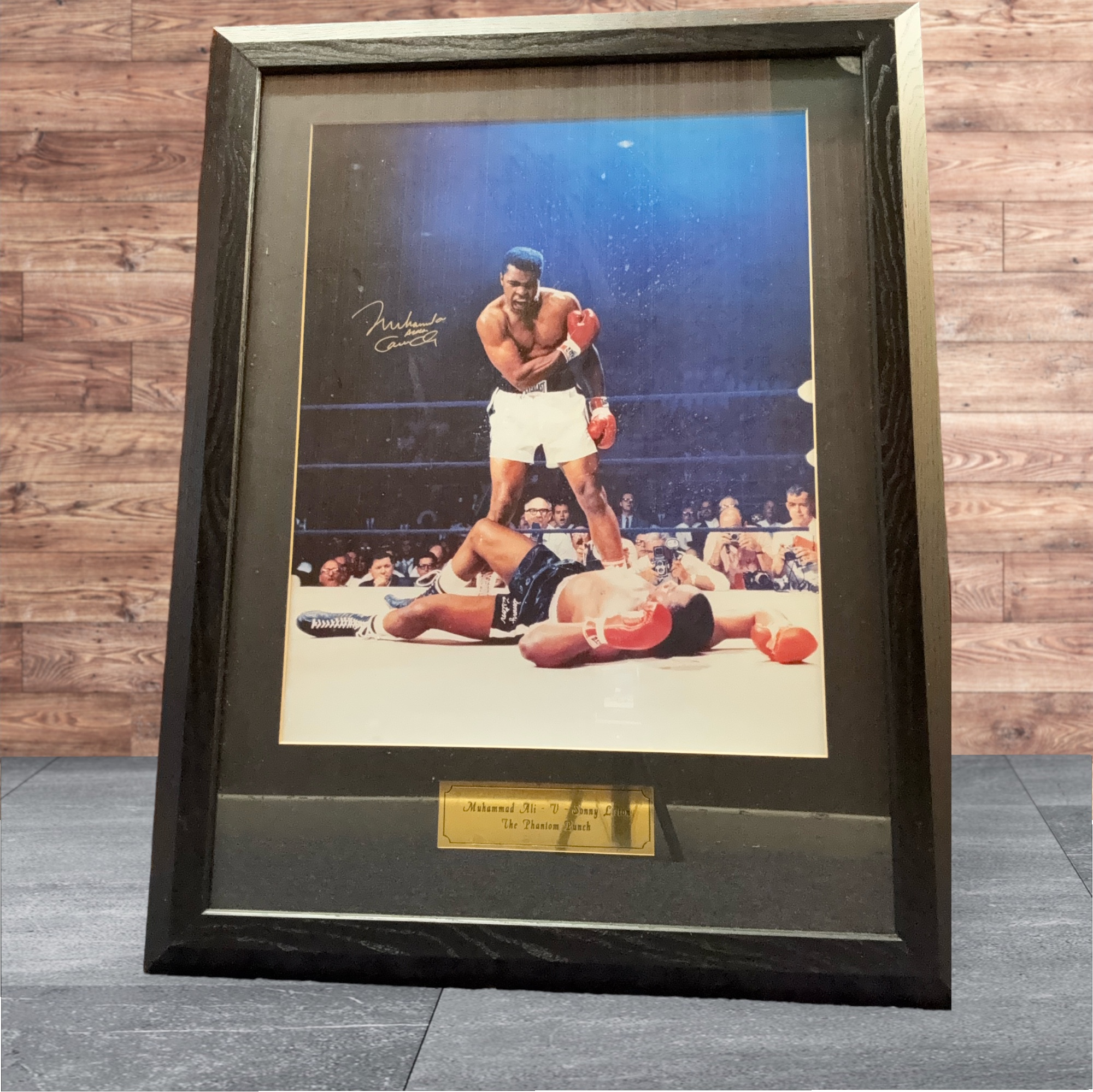 Muhammad Ali Signed Frame, Muhammad Ali - V - Sonny Liston The Phantom Punch photo. Measures 23"x30"