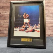 Muhammad Ali Signed Frame, Muhammad Ali - V - Sonny Liston The Phantom Punch photo. Measures 23"x30"